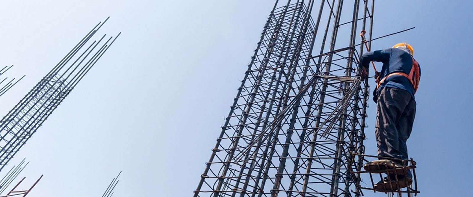 Ironworker at height on a rebar column